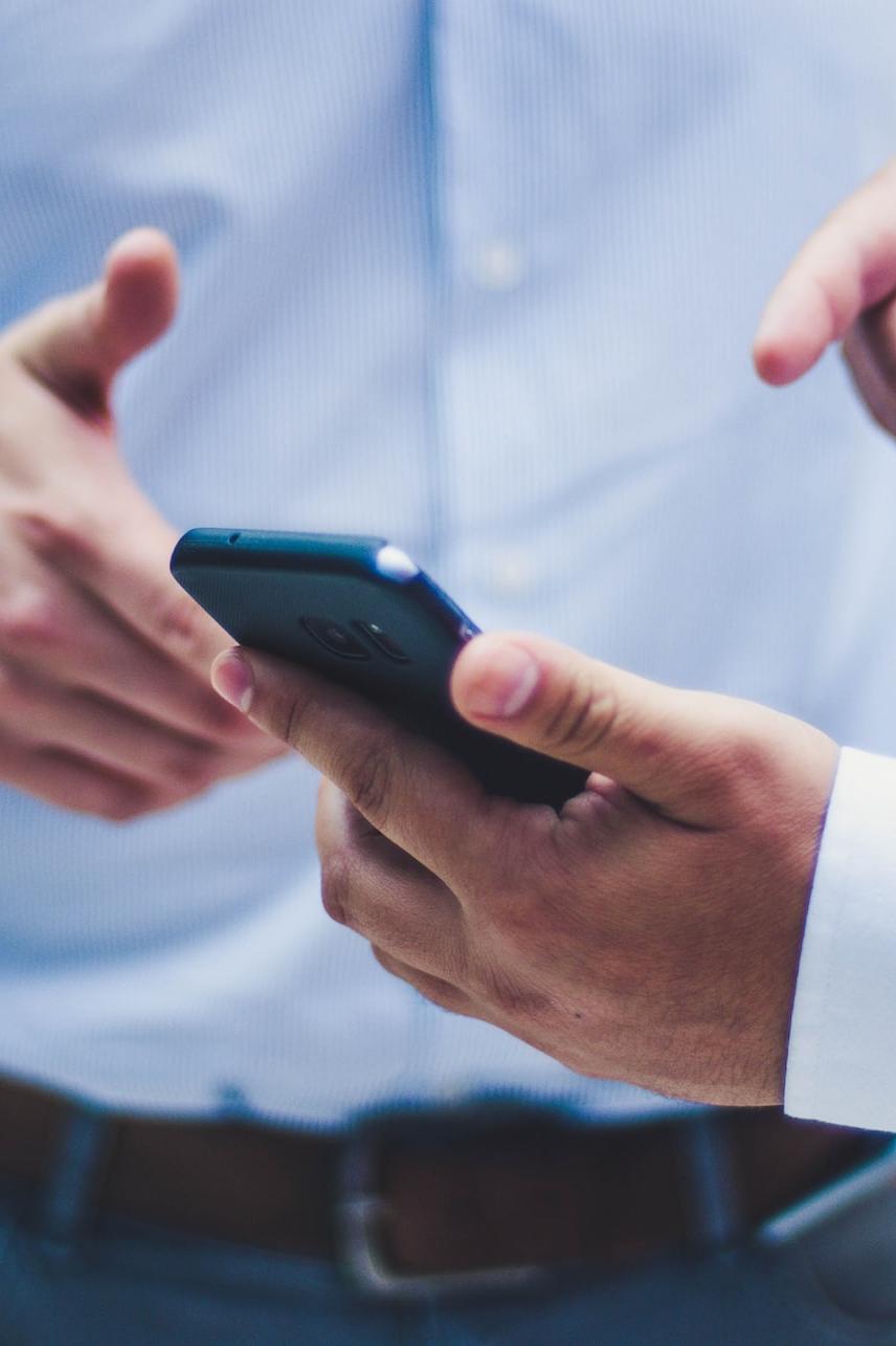 person holding black smartphone